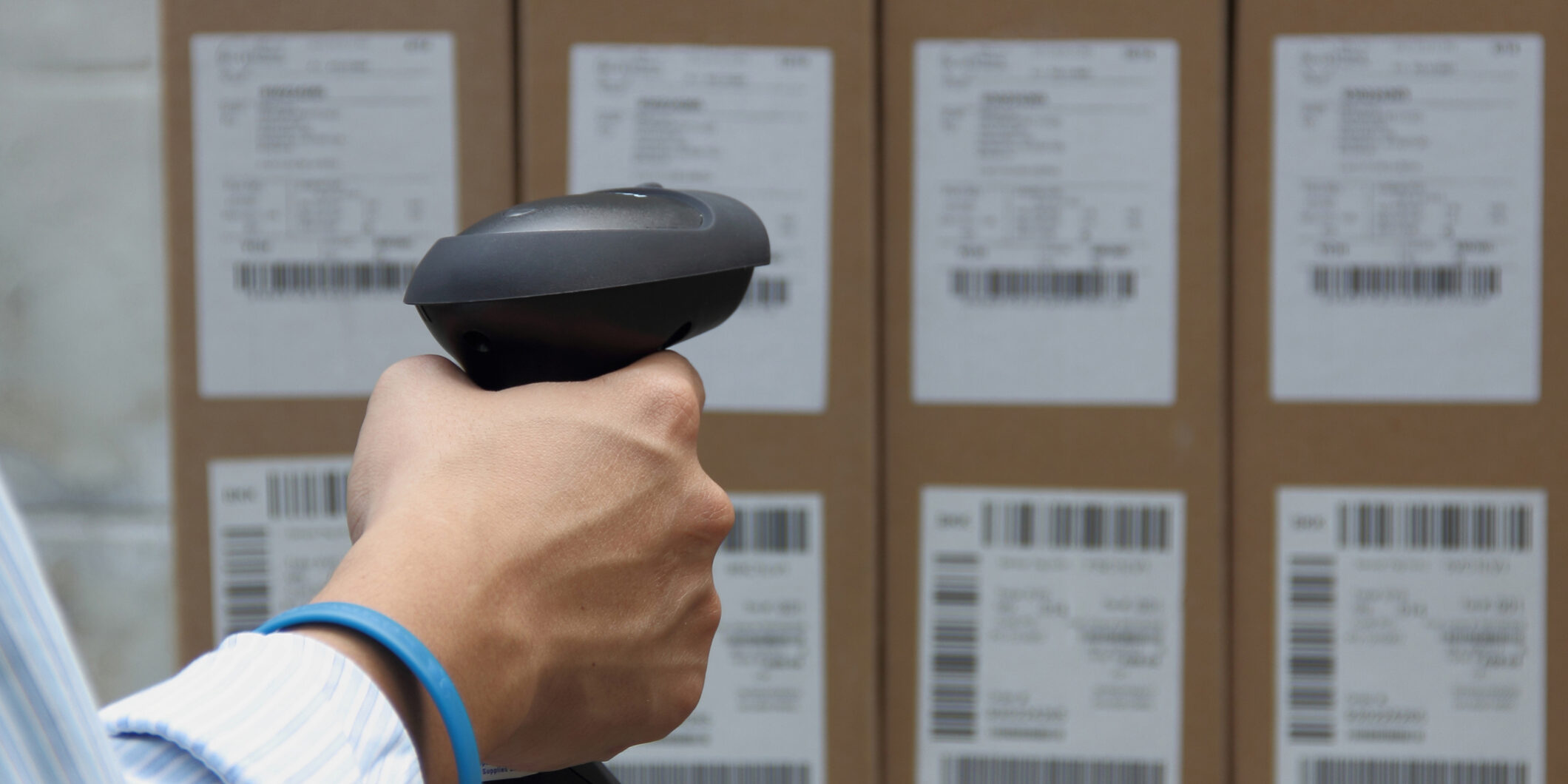 Holding barcode scanner with a label on the boxes