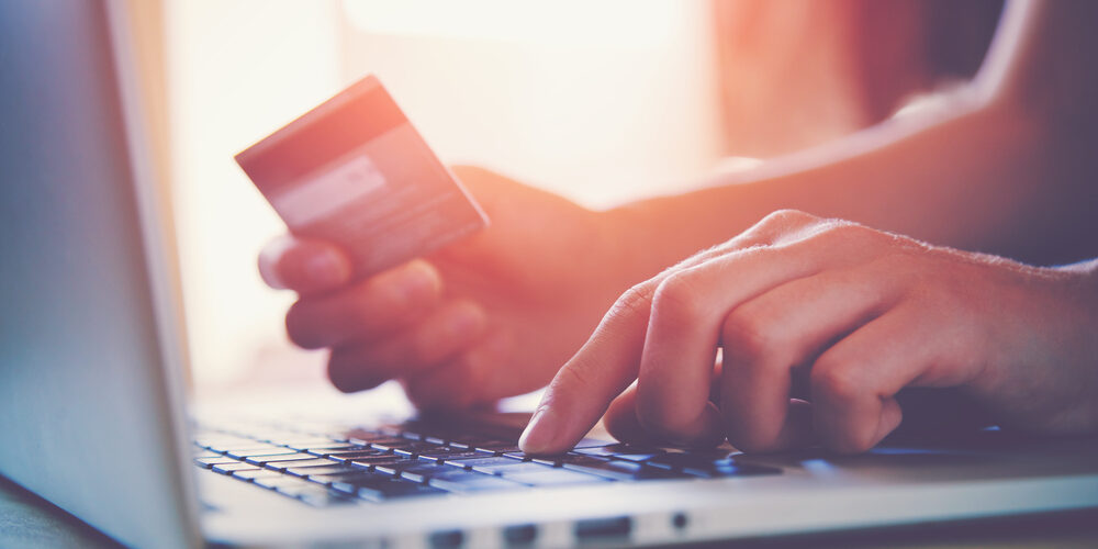 man making purchase with credit card
