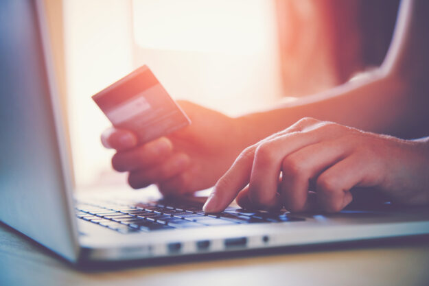 Ecommerce computer credit card man making purchase with credit card