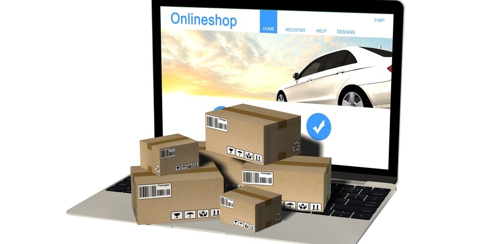 packages-on-laptop-with-online-store-open Packages on laptop with online store open on screen
