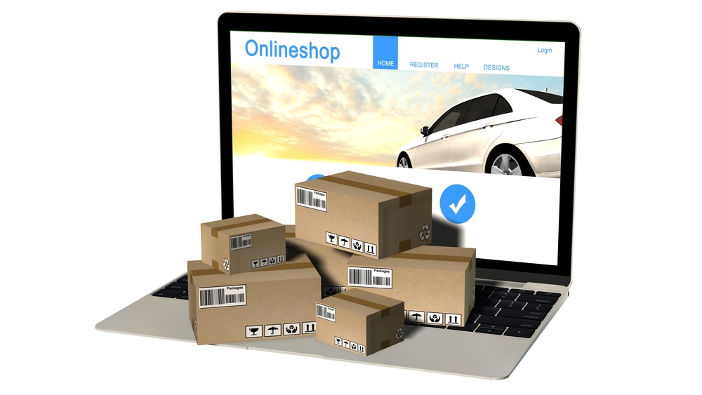 packages-on-laptop-with-online-store-open Packages on laptop with online store open on screen