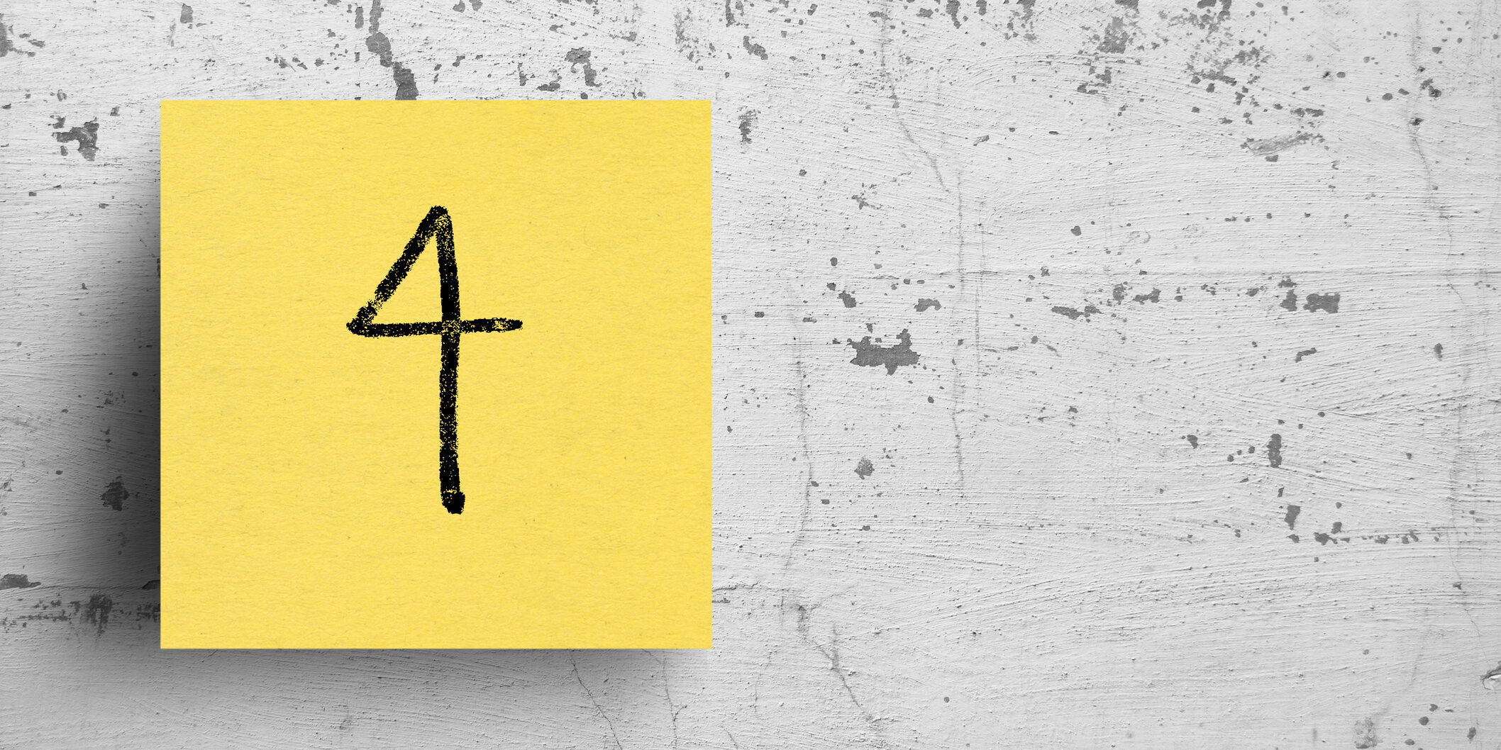 Sticky note on concrete wall, Number 4