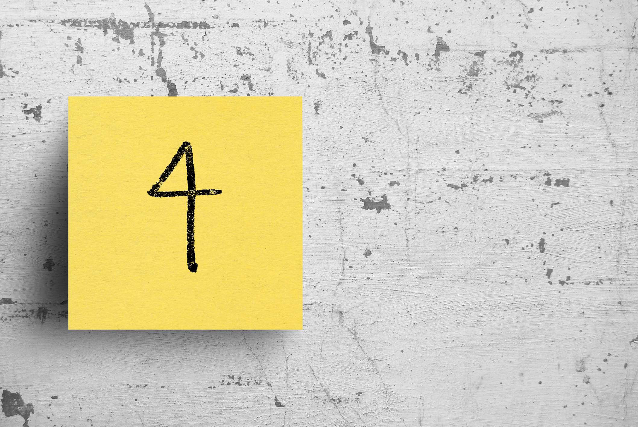 Sticky note on concrete wall, Number 4